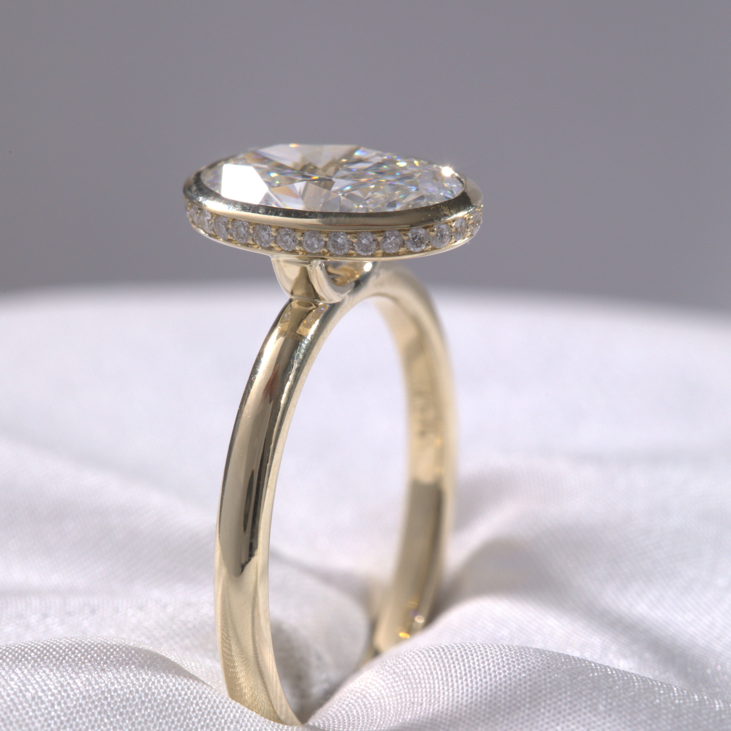 Oval Diamond Hidden Halo Bezel Set Solitaire Yellow Gold Engagement Ring