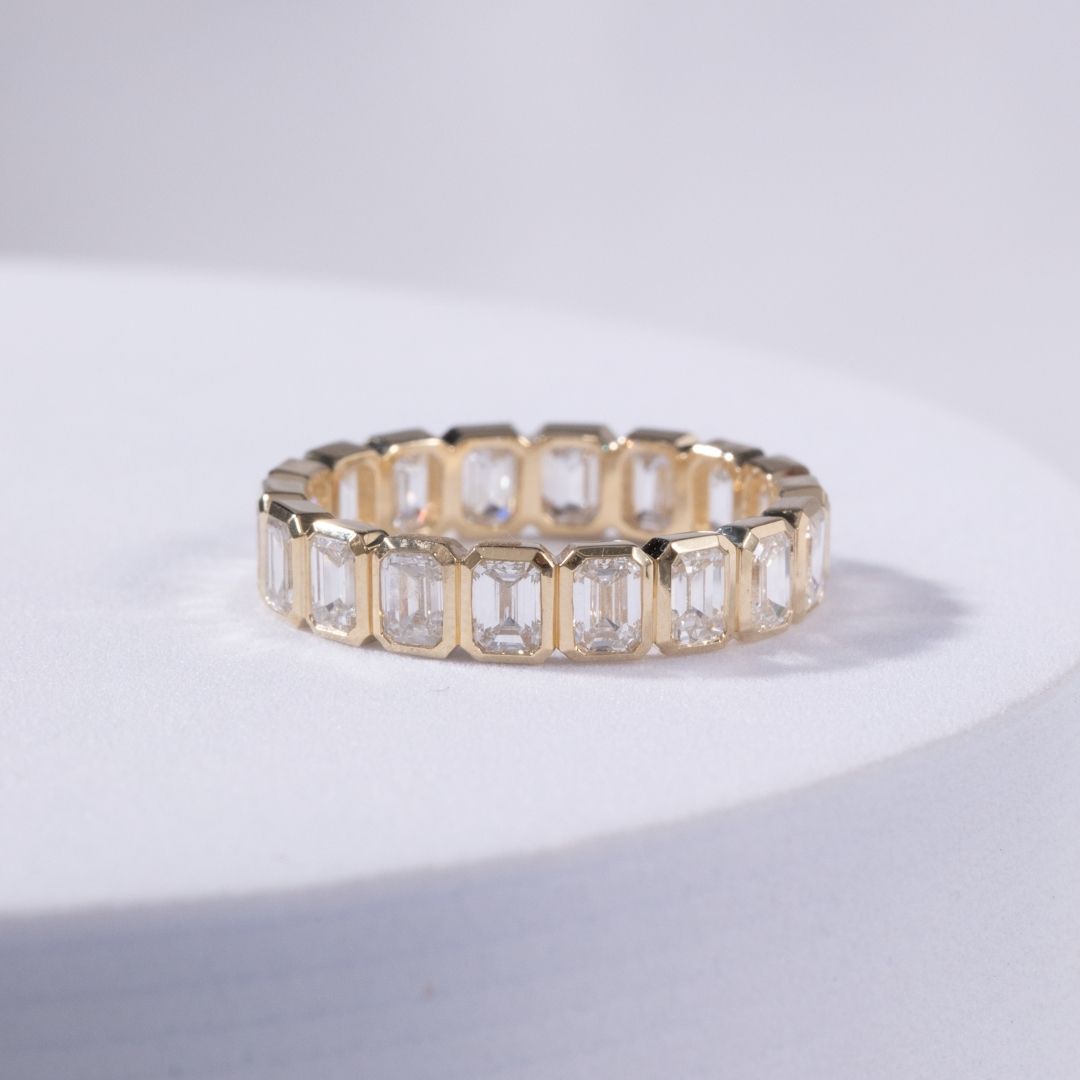 2.75ct Emerald Cut Diamond Bezel Set Yellow Gold Eternity Band