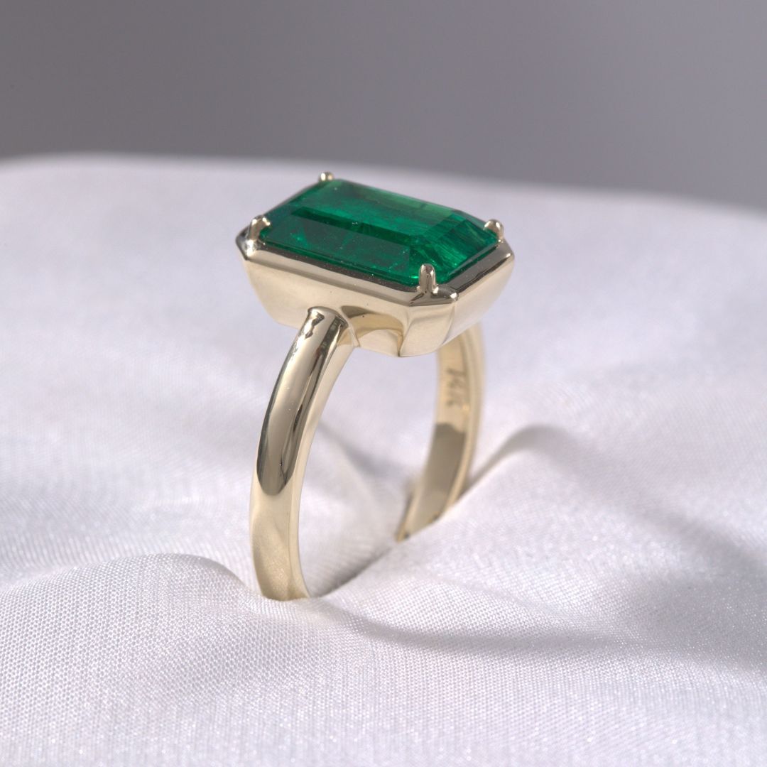 4ct Emerald Cut Green Emerald Mira Bezel Set Yellow Gold Engagement Ring