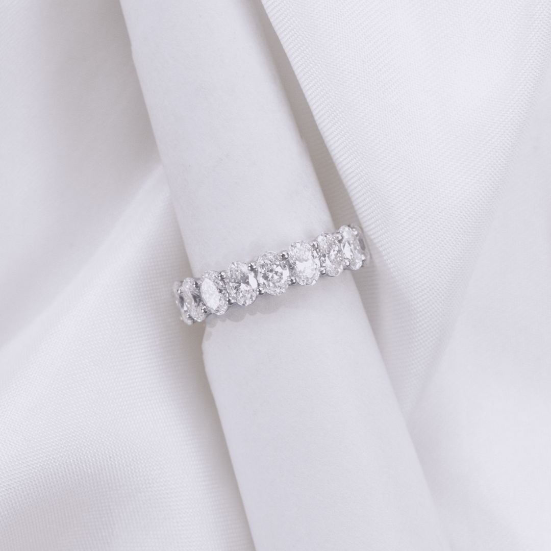 By Bonnie 4.80mm platinum anniversary half band with 2 carat oval cut diamonds