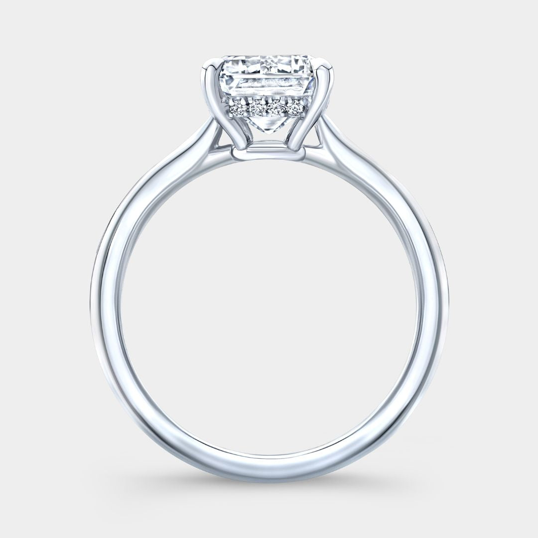 By Bonnie emerald diamond platinum ring with hidden halo and tapered cathedral design


