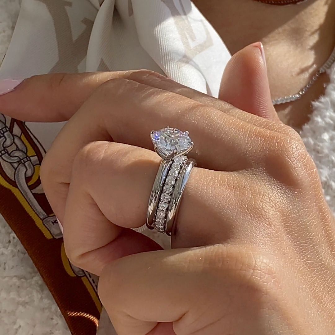 By Bonnie platinum eternity wedding ring featuring round diamonds in French pave setting