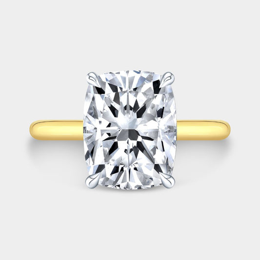 Cushion-cut diamond solitaire ring with hidden halo, yellow gold and platinum
