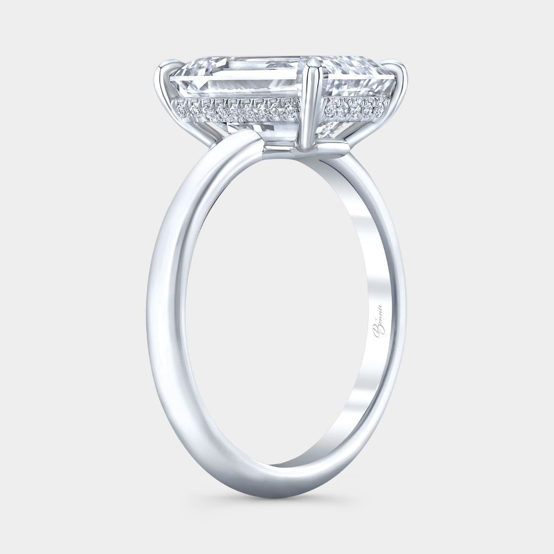 Platinum solitaire engagement ring with 4.06 carat emerald diamond