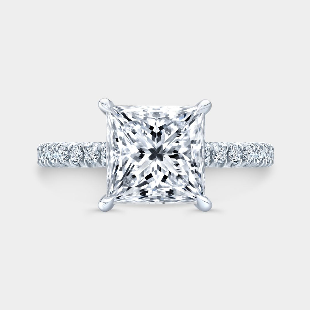 Princess-cut diamond engagement ring with hidden halo and tapered cathedral in platinum