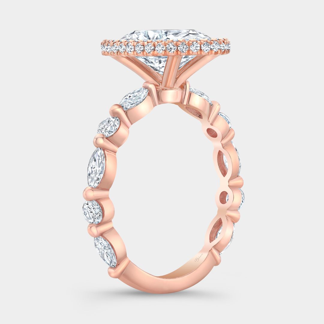 Rose gold ring with oval center diamond, seamless halo, and marquise and round side stones