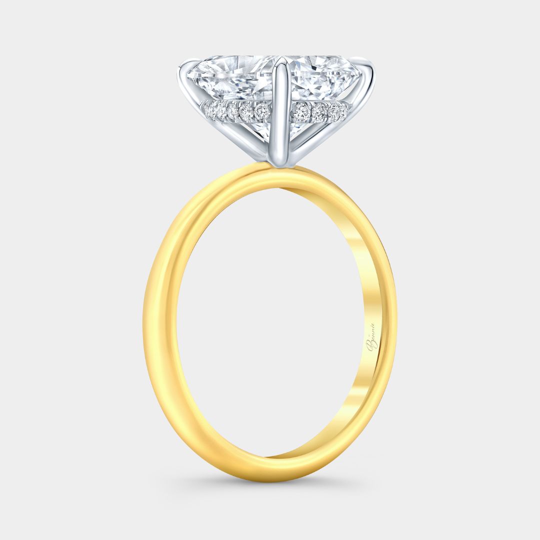 Two-tone cushion diamond engagement ring featuring hidden halo detail