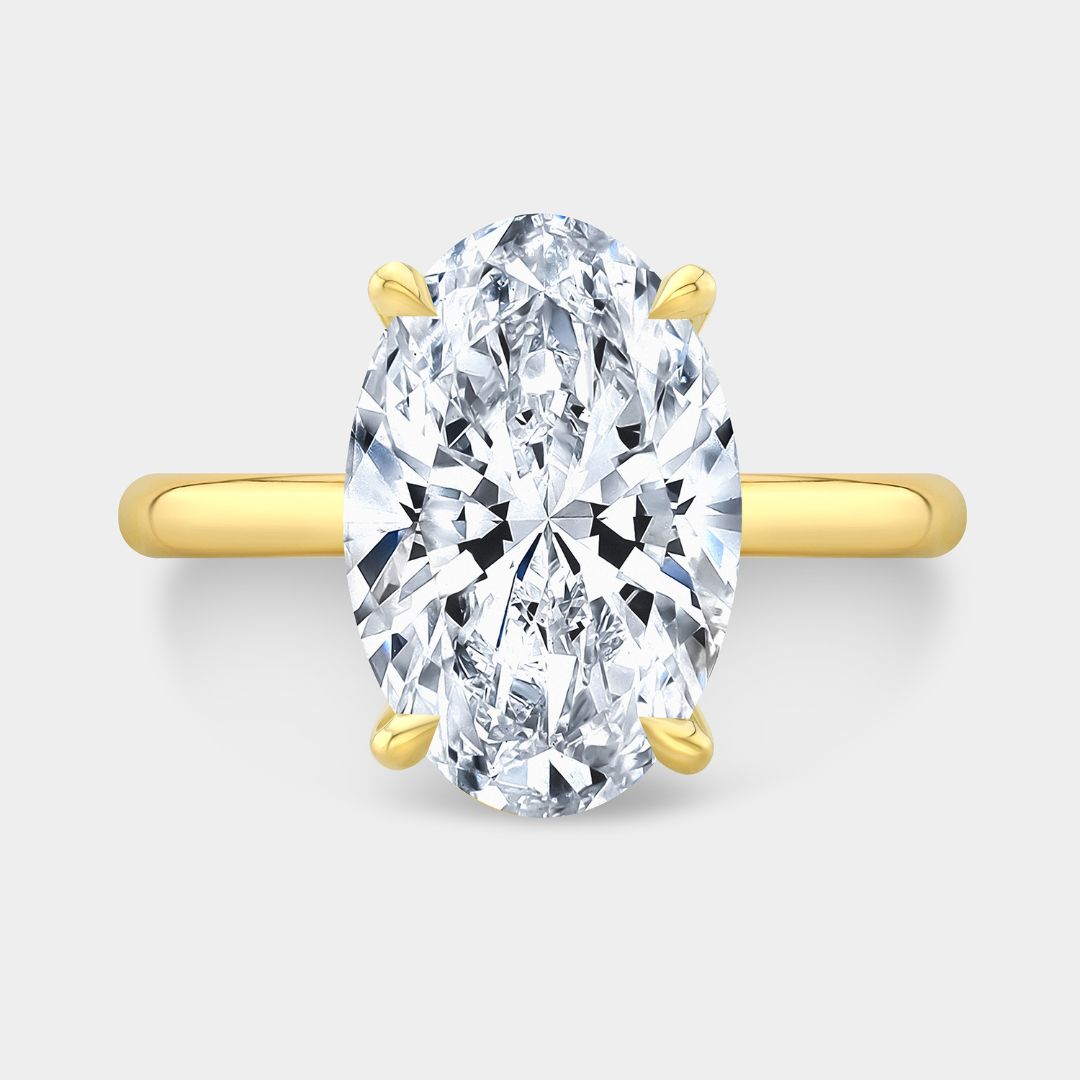 Yellow gold engagement ring with oval diamond and double hidden halo design