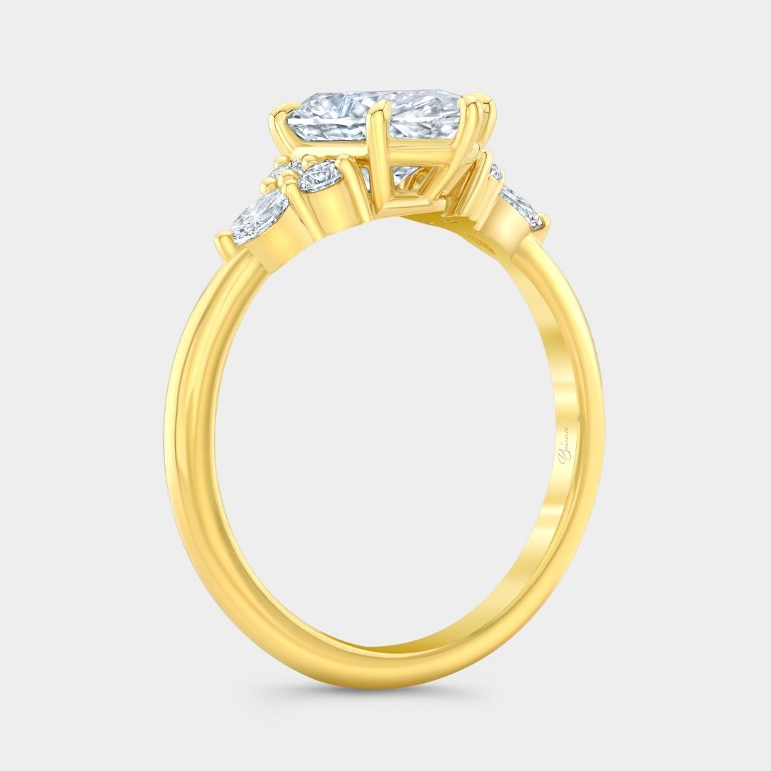 Yellow gold engagement ring with marquise diamond 7 stone cluster design