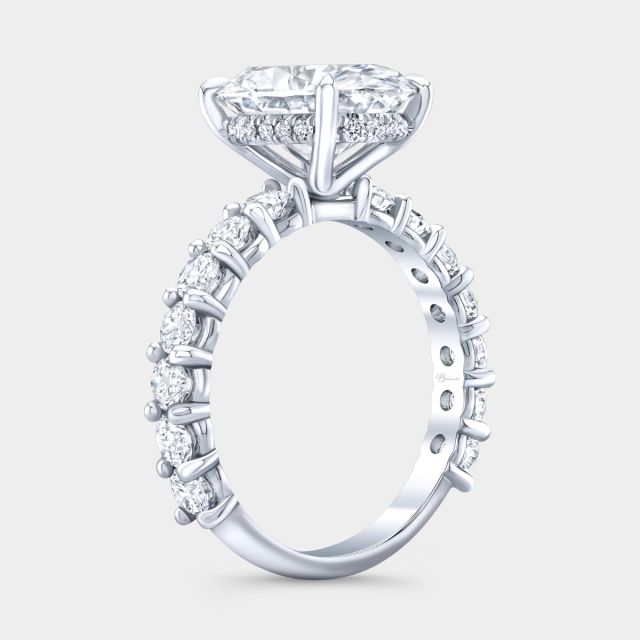 Oval diamond halo ring, platinum band.