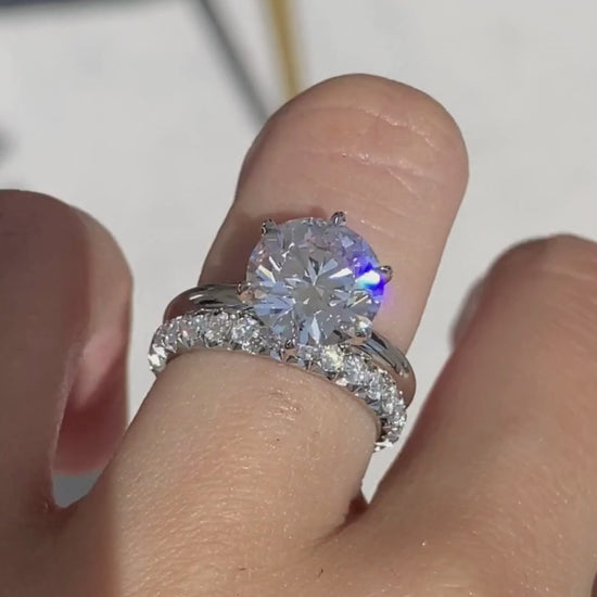 Video of 1ct round diamond French pave platinum eternity wedding band