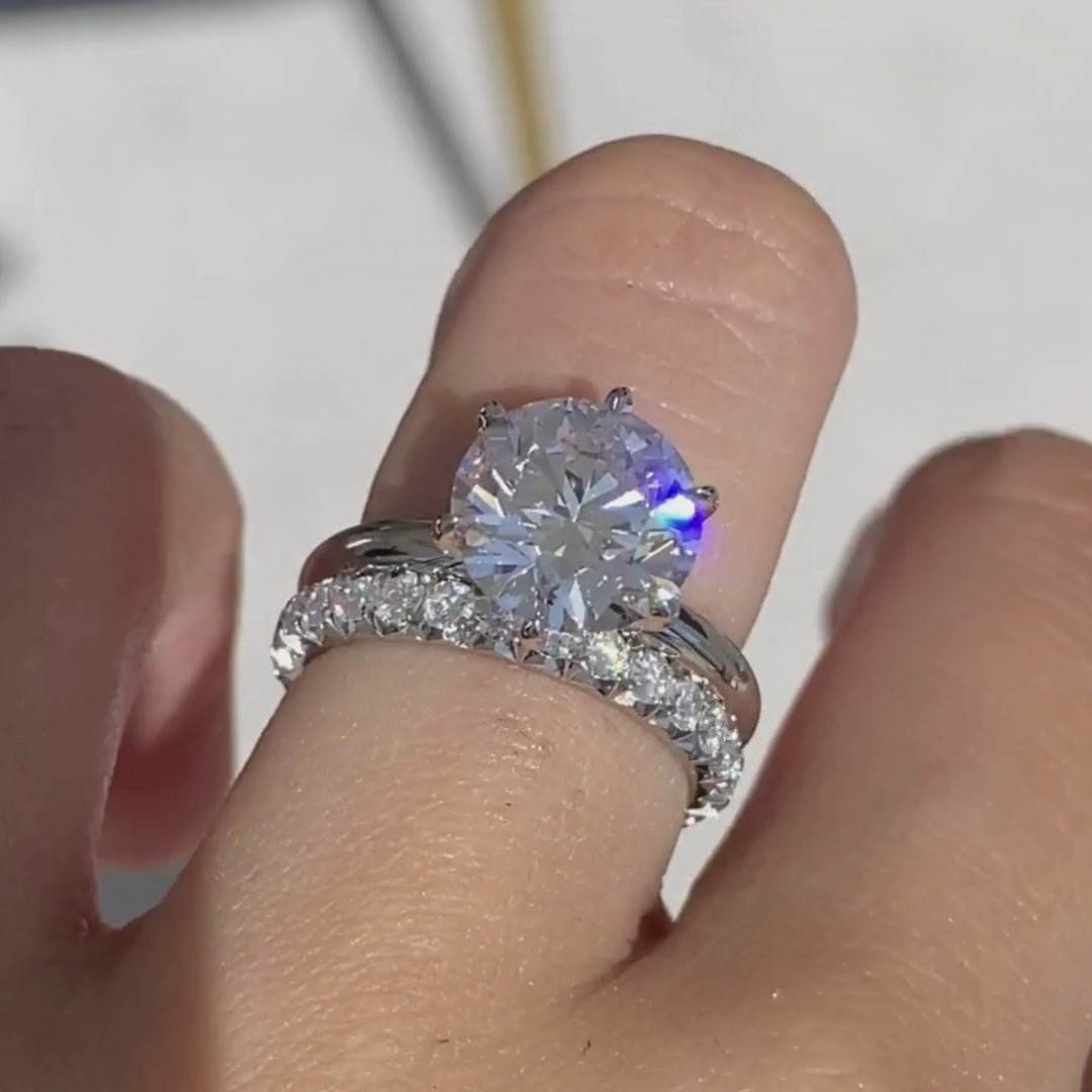 Video of 1ct round diamond French pave platinum eternity wedding band