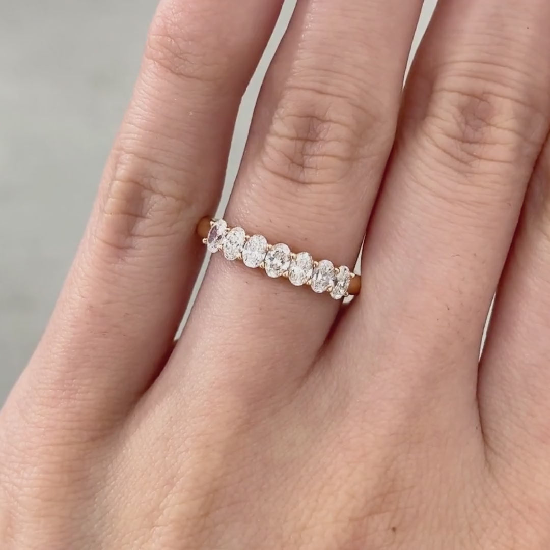 Video of 0.75ct oval diamond 7 stone rose gold wedding band